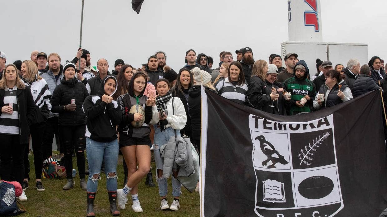 Temuka fans crowds swelling the stands and the embankment on a rainy day